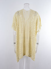 Cream open-knit V-neck beach cover-up with short sleeves and a relaxed fit.