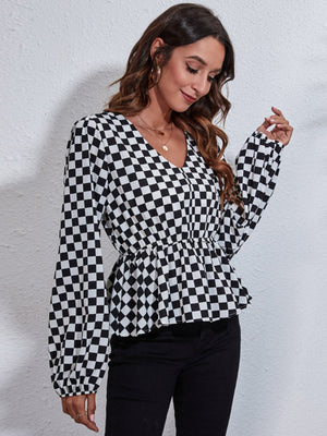 Black and white checkered peplum blouse with gathered waist and V-neck