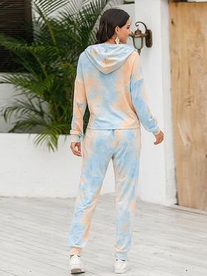 Cloud dye loungewear set with hoodie and joggers in gold and light green tie-dye pattern.