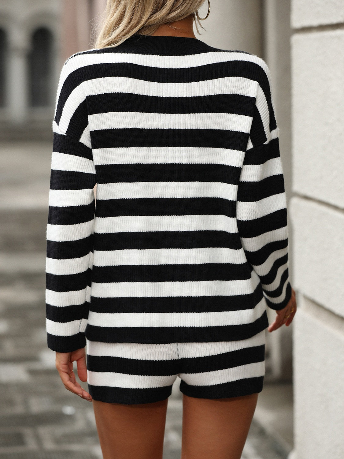 Black and white striped ribbed knit co-ord set with shorts and long sleeve sweater.