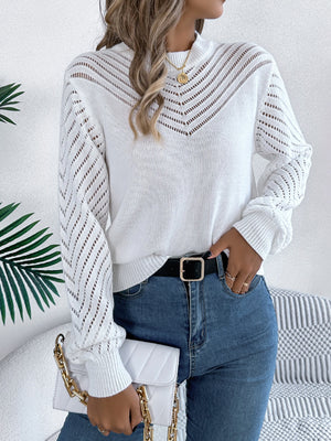 White openwork chevron knit sweater with blouson sleeves and mock neck.