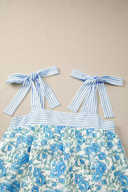 Botanical print mini dress with blue stripe tie straps and bodice