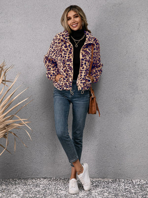 Leopard sherpa zip-up bomber jacket with drawstring hem and pockets.