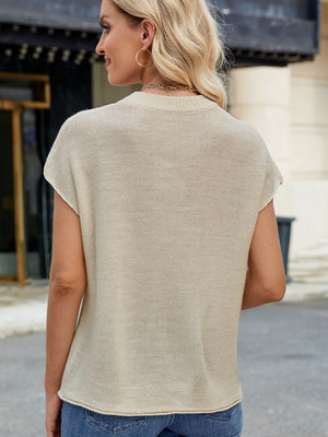 Tan knit cap sleeve top with vertical seam detail.