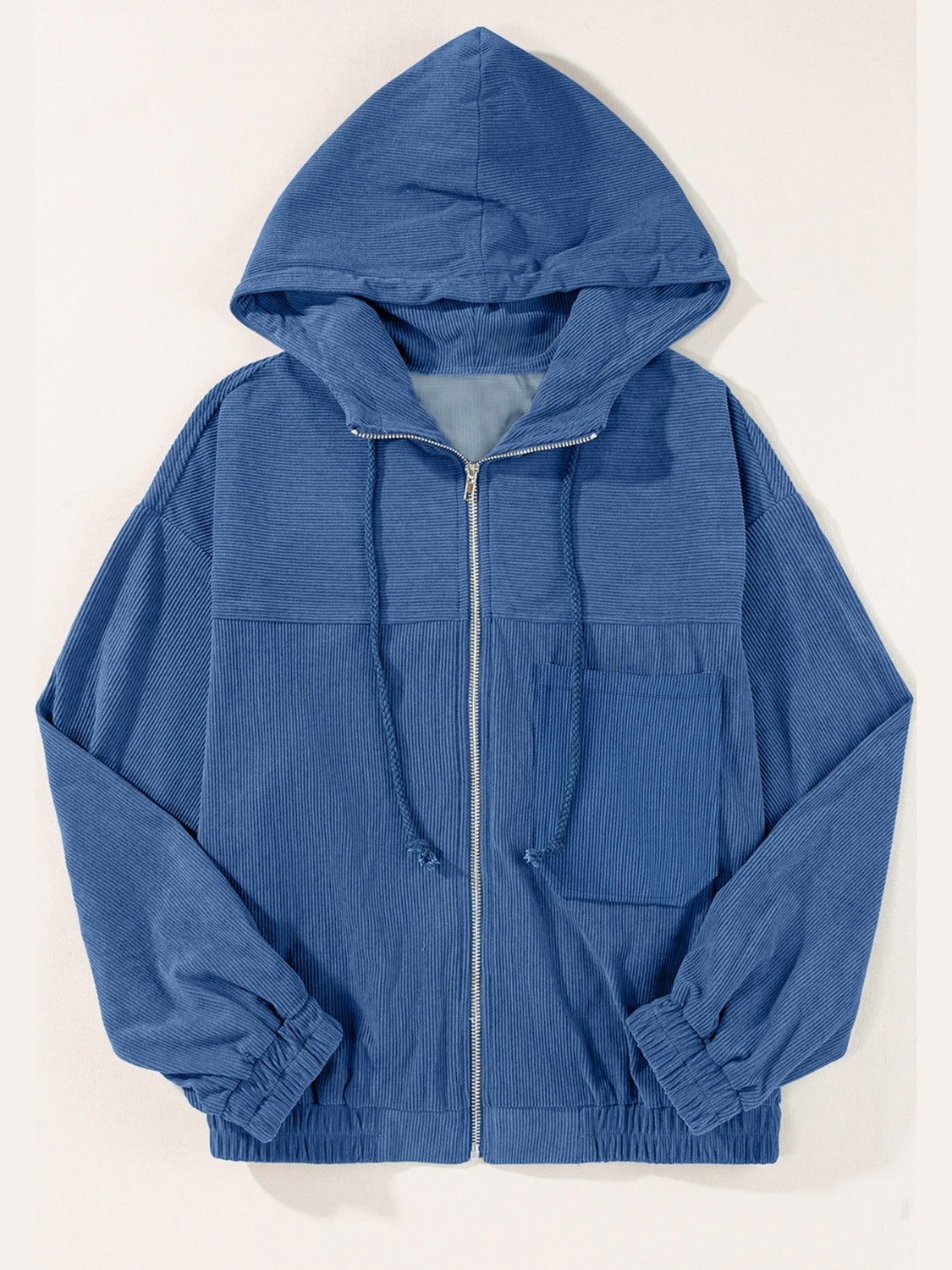 Dusty Blue corduroy relaxed fit zip-up hoodie with drawstring hood and front pocket.