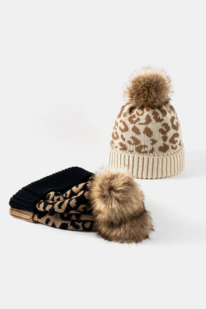 Textured leopard print acrylic beanie with faux fur pom in beige and black.