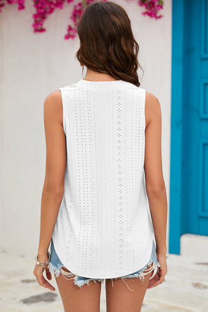 White perforated V-neck sleeveless blouse with eyelet detail and curved hem.