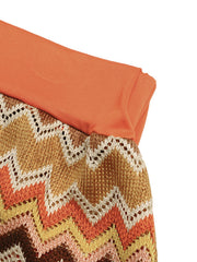 Zigzag knit two-piece set with orange waistband and colorful chevron pattern.