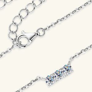 Silver triple moissanite bar pendant necklace with lobster clasp and adjustable chain.