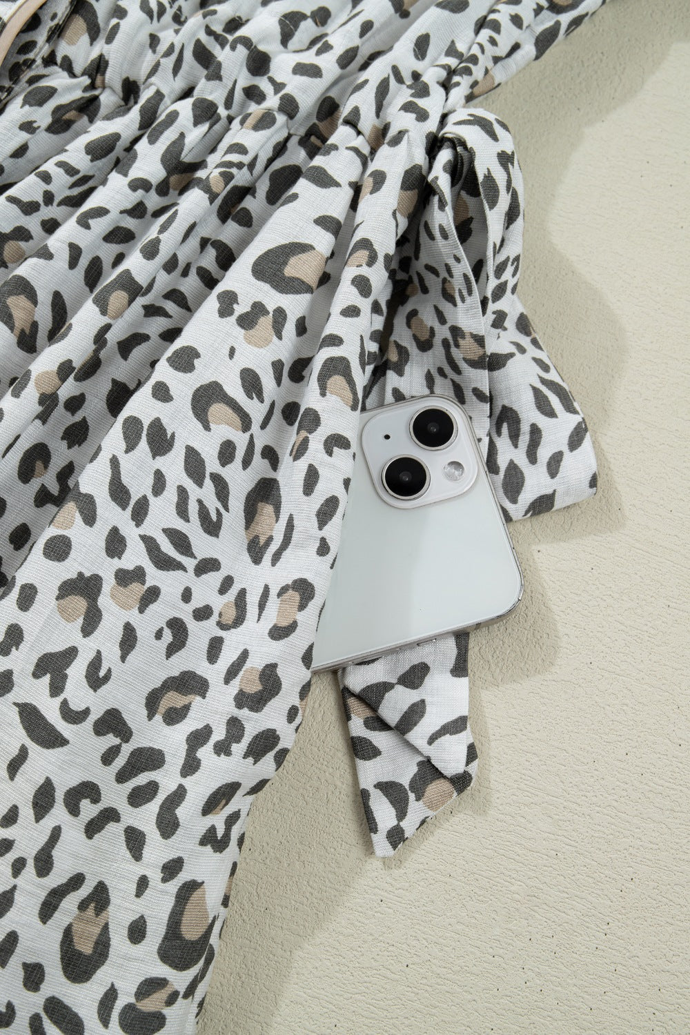 Print Button-down Midi Dress in white with black and tan leopard print, showing a side pocket detail.