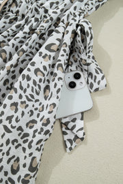 Print Button-down Midi Dress in white with black and tan leopard print, showing a side pocket detail.
