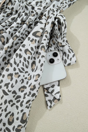 Print Button-down Midi Dress in white with black and tan leopard print, showing a side pocket detail.