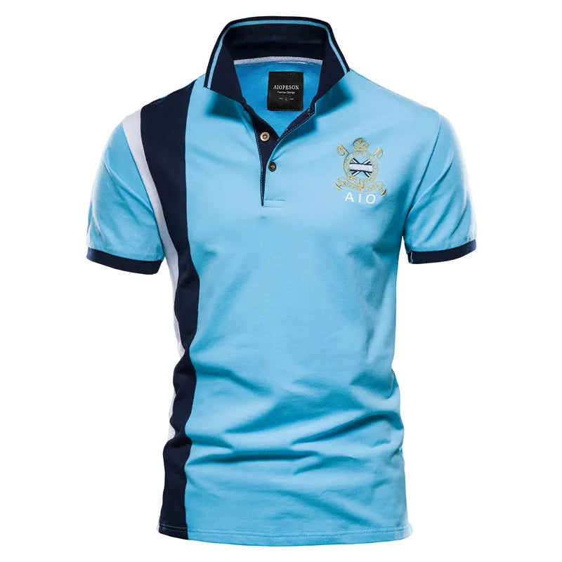 Colorblock polo shirt with crest embroidery and navy collar.