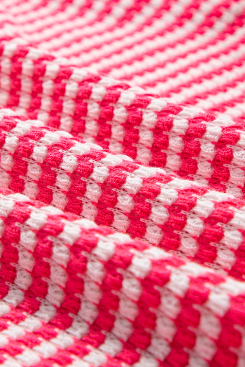Pink and white textured stripe blouse with balloon sleeves.
