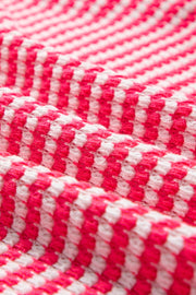 Pink and white textured stripe blouse with balloon sleeves.