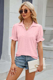 Pink eyelet polo blouse with short puff sleeves and ruffled cuffs