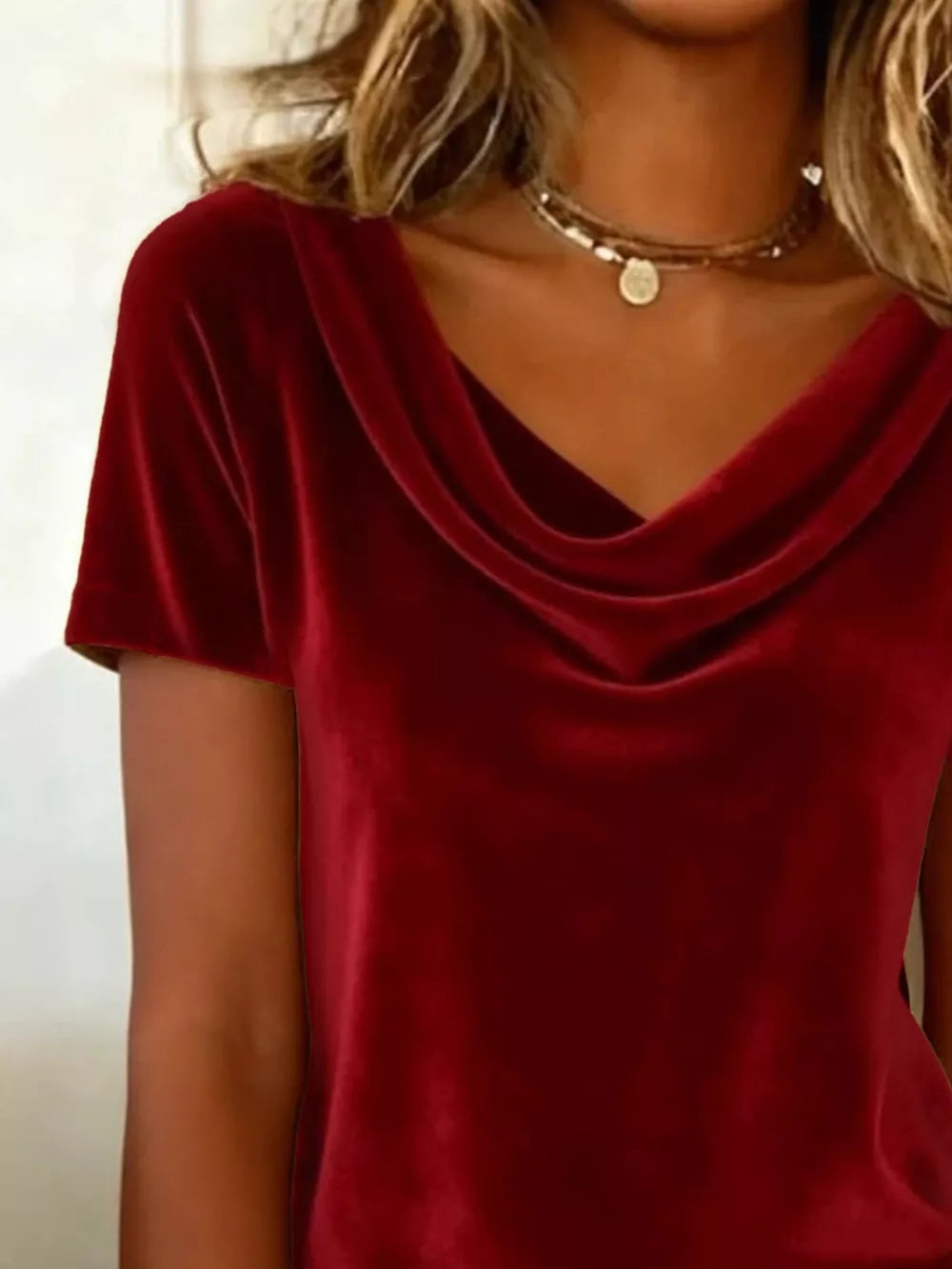 Burgundy velvet t-shirt with short sleeves and a draped cowl neckline.