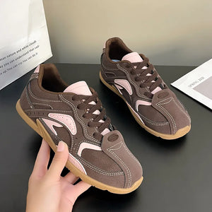 Retro Runner panel sneakers in brown with blush pink accents and white stitching.