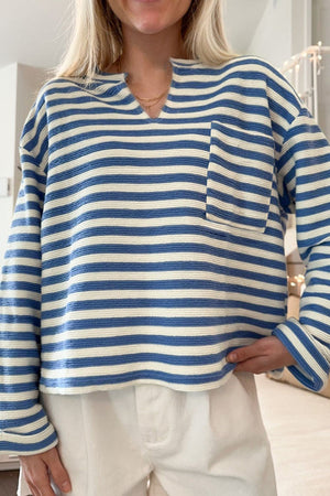 Peacock blue and white striped textured henley top with chest pocket and notch neckline.