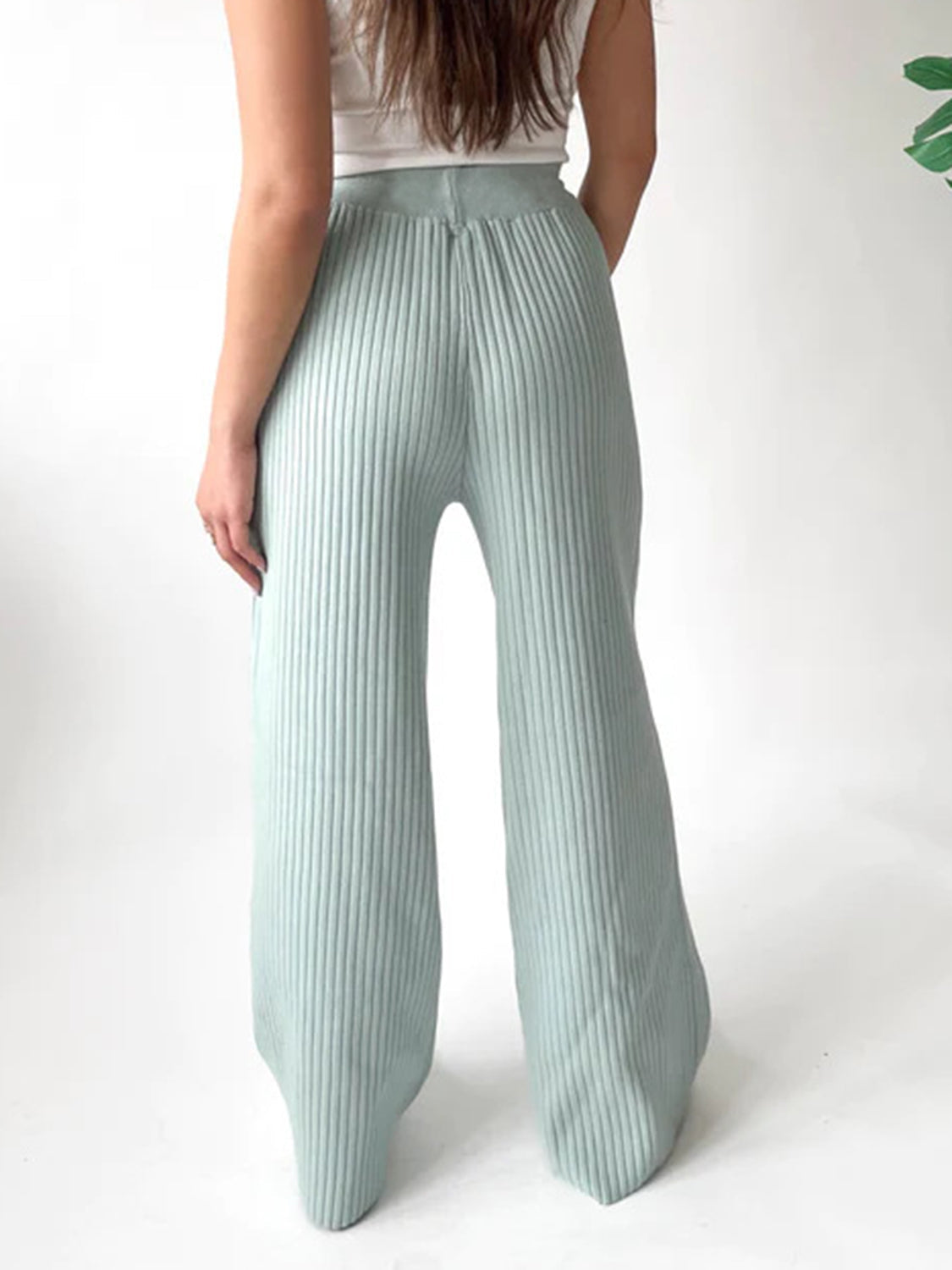 Mint blue ribbed knit palazzo trousers with a wide leg