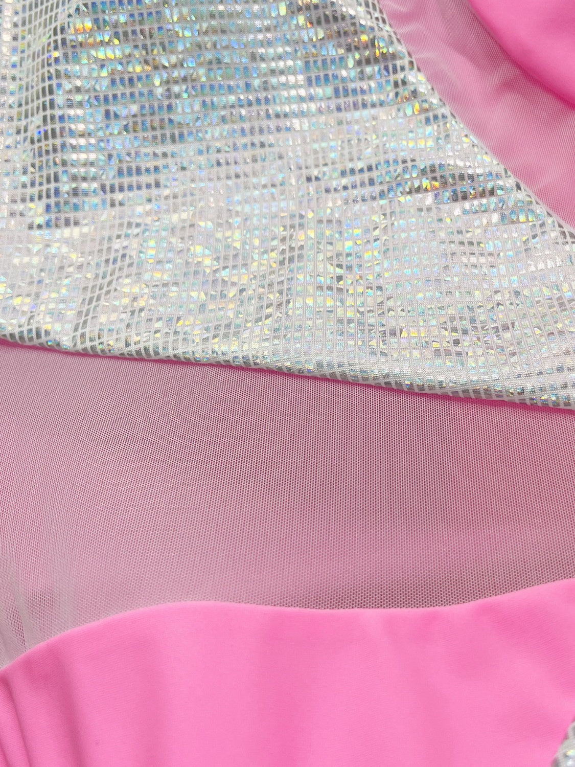 One-shoulder swimsuit with sequin panel and pink mesh detail