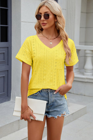 Yellow perforated pocket tee with rolled sleeves and V-neck