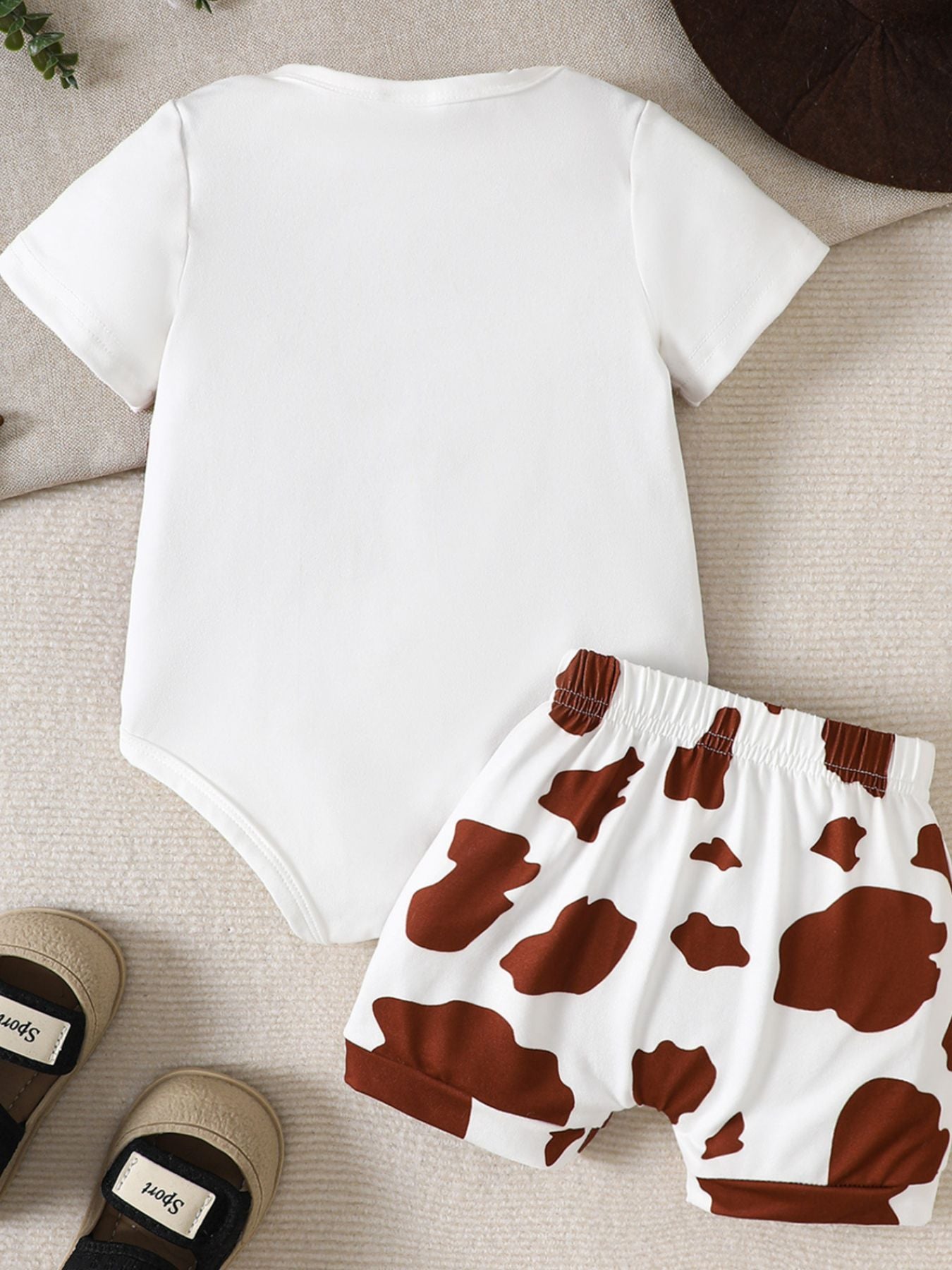 White baby bodysuit with brown cow print shorts, elastic waistband, casual baby outfit