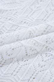 White openwork crochet cardigan with a diamond pattern and breathable acrylic knit.