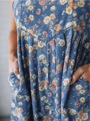 Floral denim overalls with wide legs and pockets.