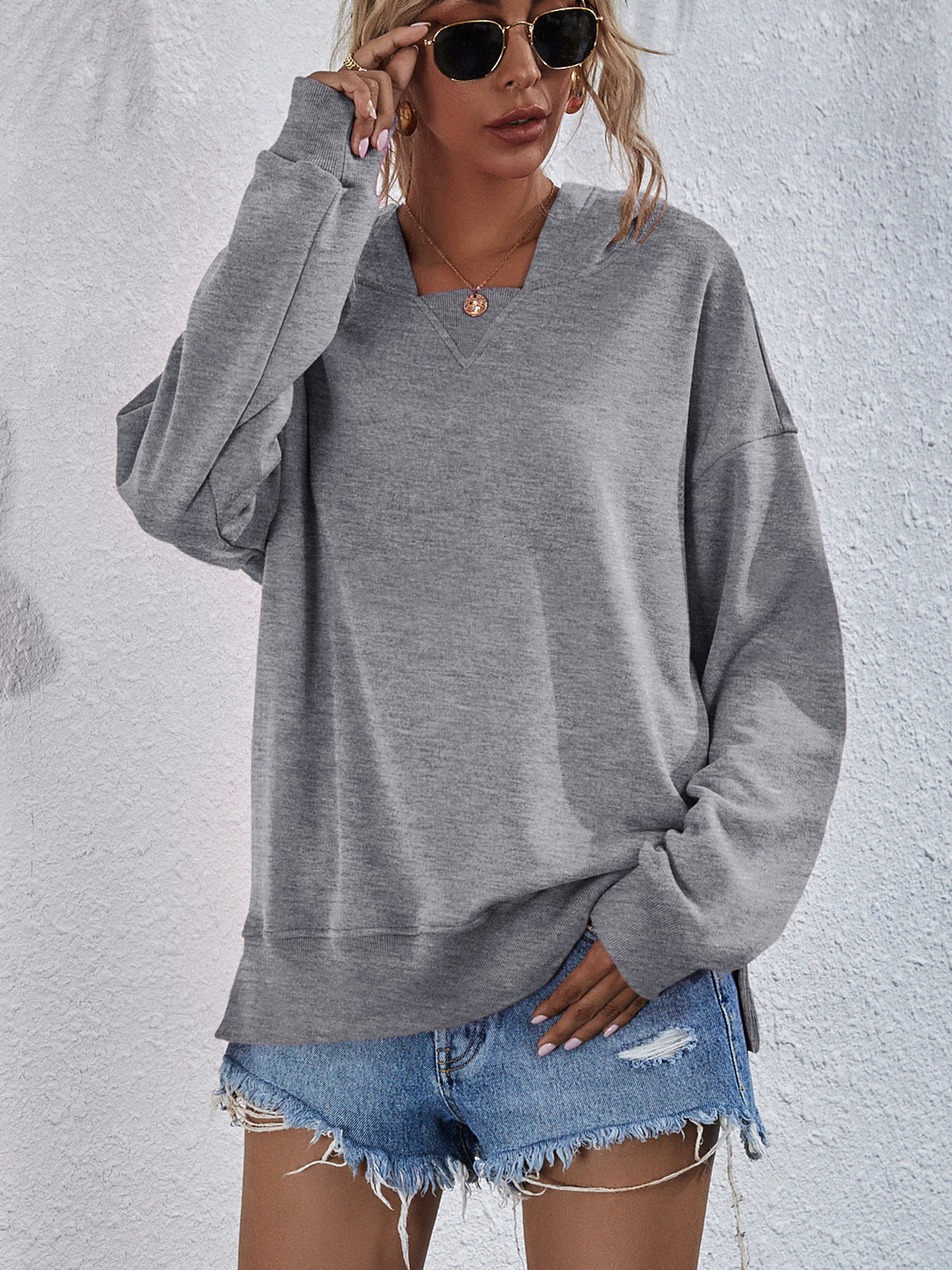 Heather gray sweatshirt with split hem and V-neck detail
