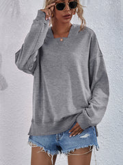 Heather gray sweatshirt with split hem and V-neck detail