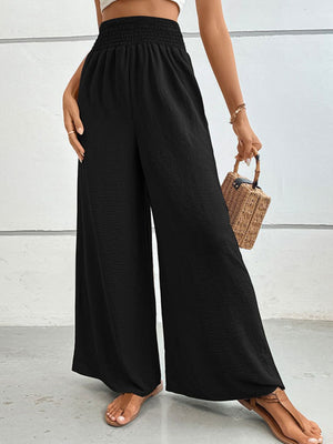 Black textured smocked waist palazzo maternity trousers with wide legs