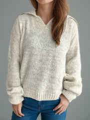 Beige textured knit polo sweater with a relaxed fit and ribbed cuffs and hem.