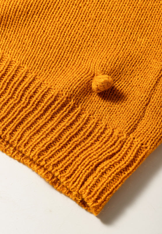 Caramel acrylic bobble cardigan with textured knit and ribbed hem.