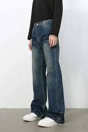 Faded wash flare jeans in dark denim with a relaxed fit and bootcut leg.