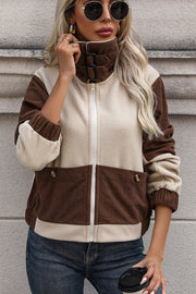 Colorblock corduroy fleece jacket with a high neck and zip closure.