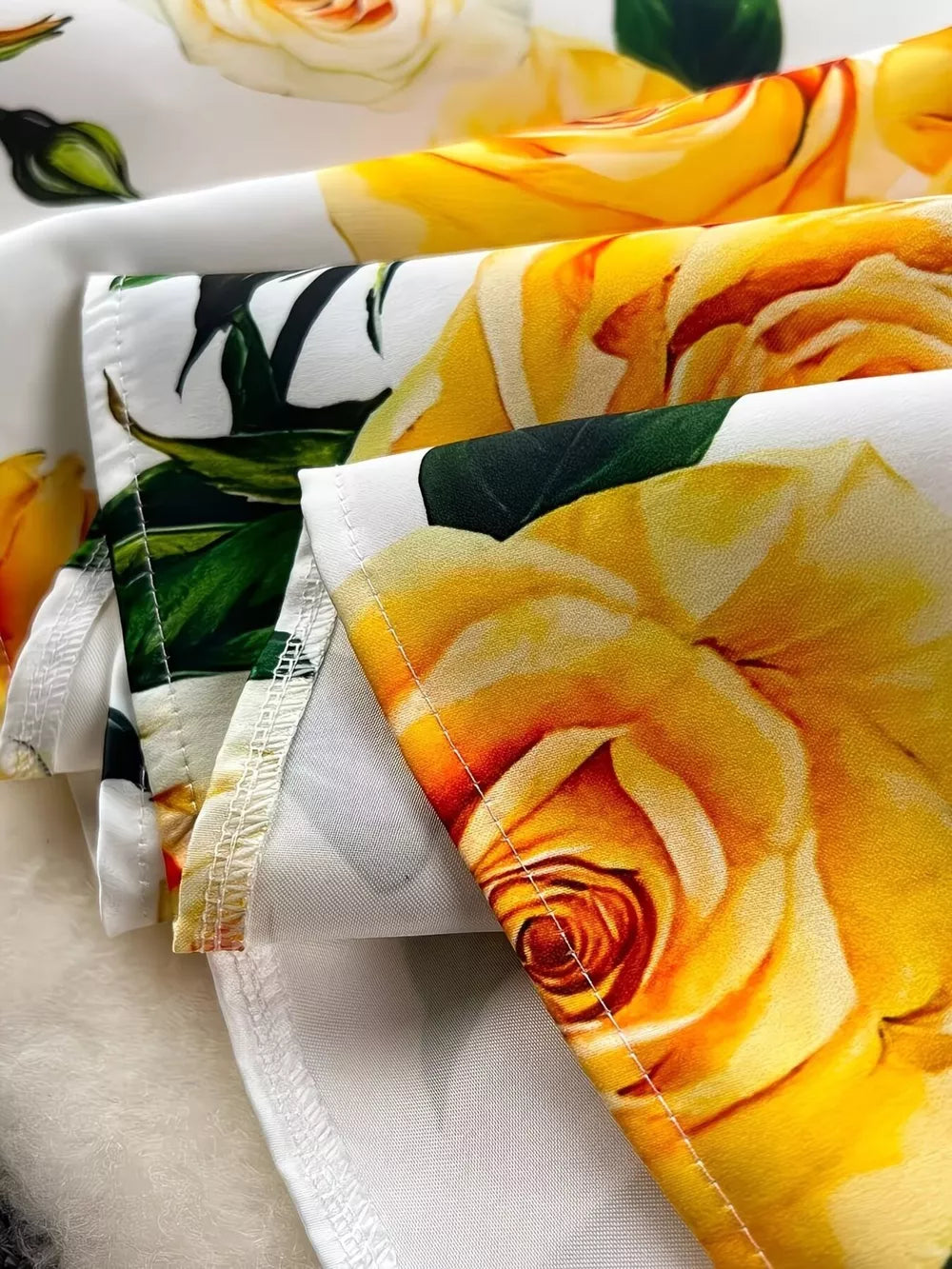 Yellow floral midi dress with pleated skirt detail