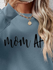 Mom At graphic sweatshirt in Misty Blue with crew neck and long sleeves.