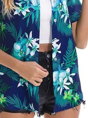 Tropical hibiscus print button-up shirt in dark blue with white and green flowers and leaves.