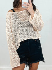 Tan open-knit slouchy shoulder sweater with long sleeves and a relaxed fit.