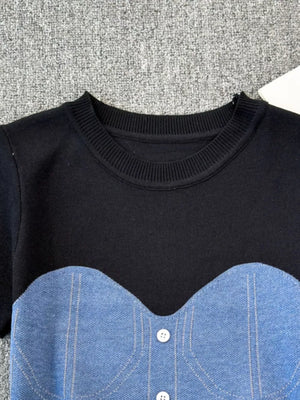 Color block knit t-shirt with ribbed neckline and denim bustier detail in black with blue.