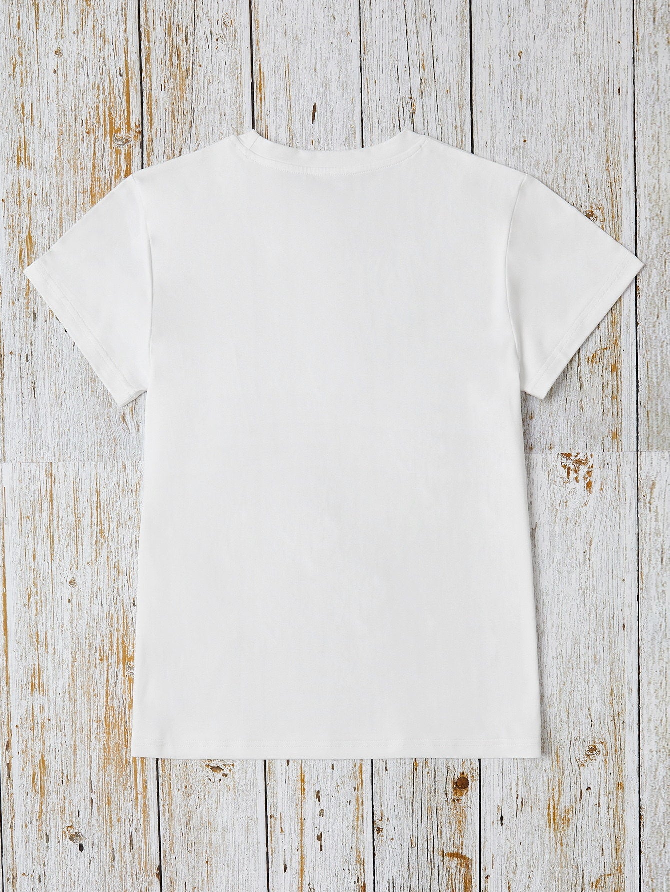White graphic tee with short sleeves and a crew neck.
