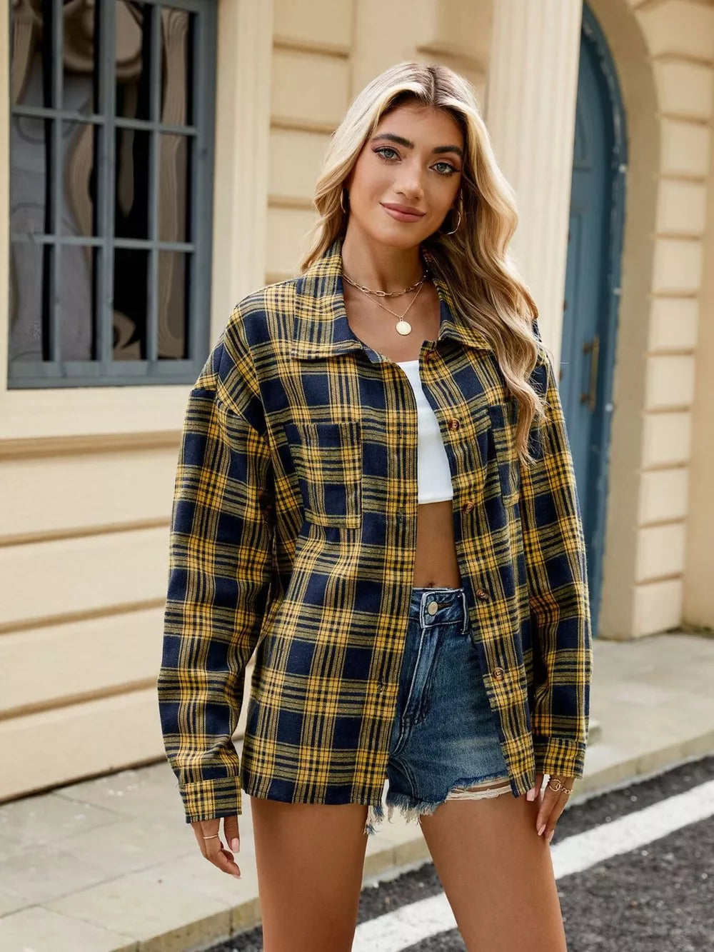 Black And White button-up shirt featuring buttoned and plaid