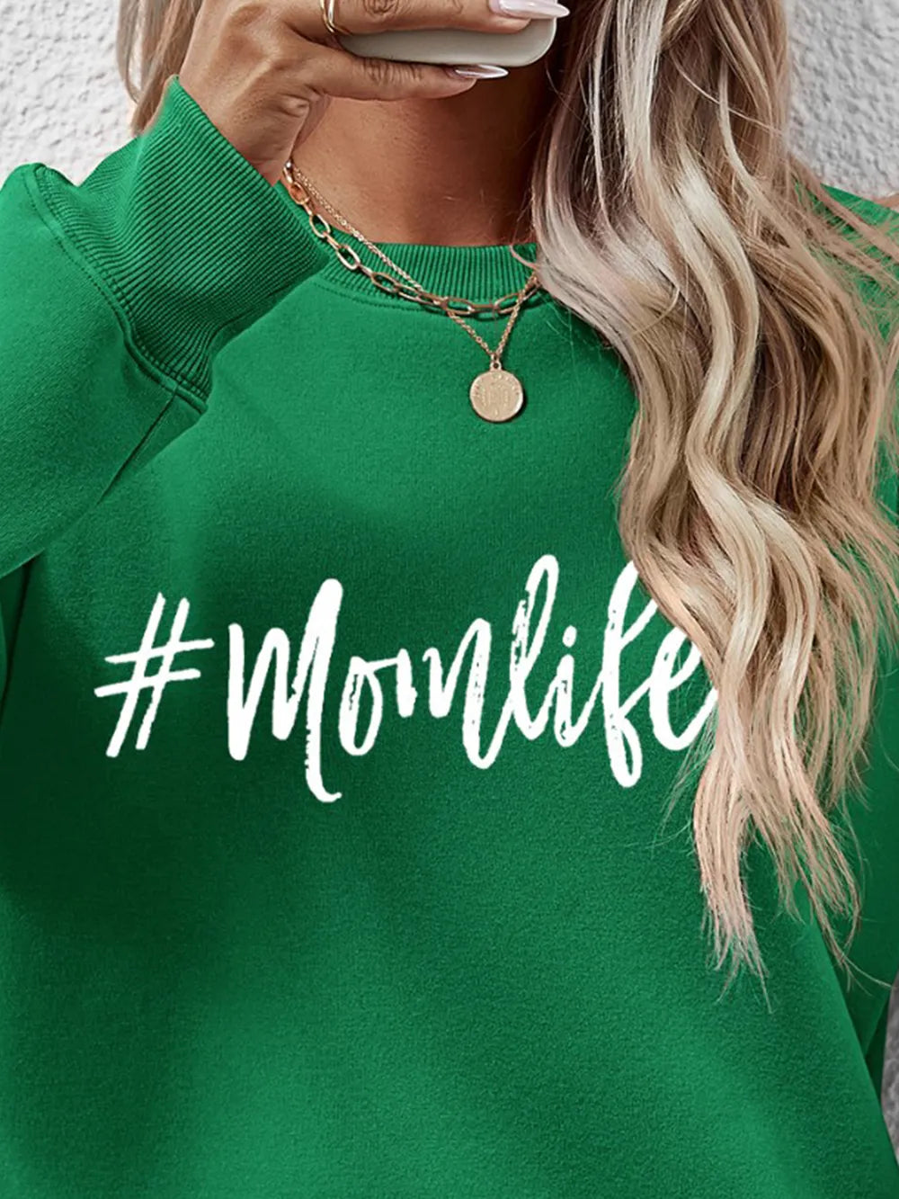 Green crewneck sweatshirt with white #Momlife graphic print