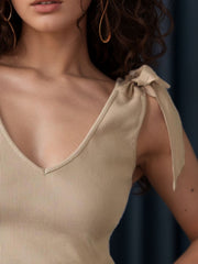 Tan ribbed knit tank top with V-neck and bow shoulder straps
