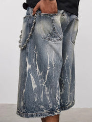 Men's loose fit blue denim shorts with white distressed wash and skull chain detail.