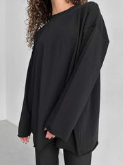 Black oversized cotton jersey top with long sleeves and a crew neck.