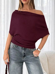 Wine red ruched off-shoulder knit t-shirt with short dolman sleeves.