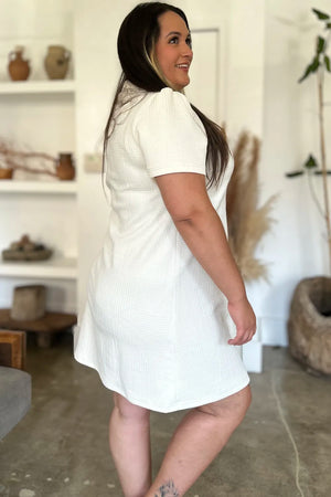 Ivory textured V-neck short sleeve mini dress with geometric pattern