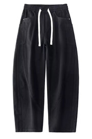Black relaxed fit cotton jeans with drawstring waist and pocket details.